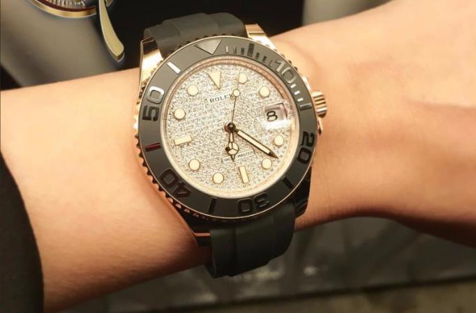 The black strap fake watch has diamond-paved dial.