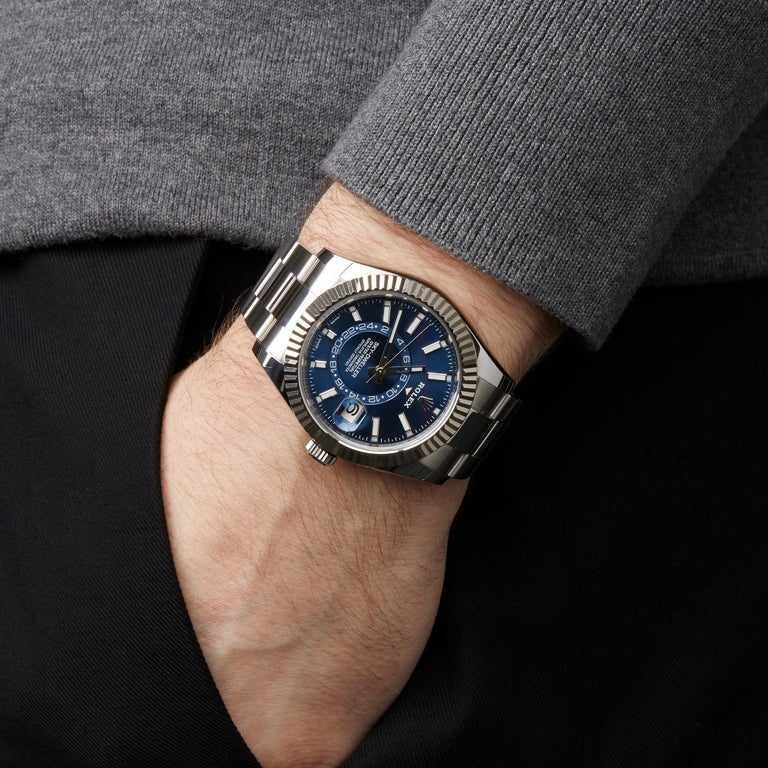 The blue dial fake watch has date window.