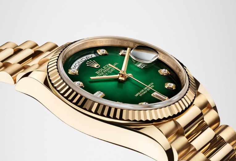 The 36mm replica watch has a green dial.